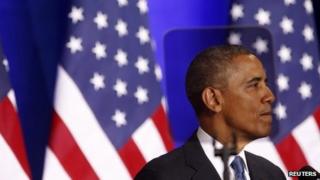 US President Barack Obama is seen through a teleprompter as he speaks about the National Security Agency from the Justice Department in Washington 17 January 2014