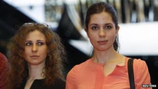 Members of Russian punk rock band Pussy Riot Nadezhda Tolokonnikova and Maria Alyokhina (L) arrive for the inaugural Prudential Eye Awards in Singapore 18 January 2014