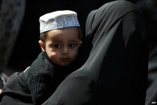 Iraqi Shia Muslims - mother and baby - in Baghdad, December 2011, commemorating Ashura