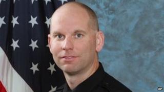 In this undated photo released by Bay Area Rapid Transit shows police Sgt Tom Smith.