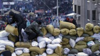 Activists build a barricade in central Kiev, Ukraine, Sunday Jan. 26, 2014.