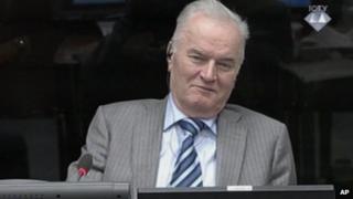 Former Bosnian Serb army commander Gen. Ratko Mladic smiles during his appearance at the Yugoslav war crimes tribunal Tuesday Jan. 28, 2014 in the Hague Netherlands.