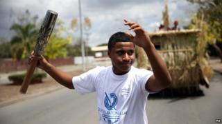 Boy carrying baton