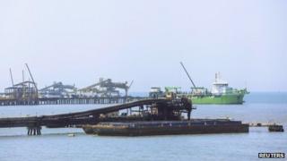 Barge being loaded with coal in Santa Marta, Colombia