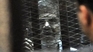 Mohammad Morsi in court on 28 Jan 2014