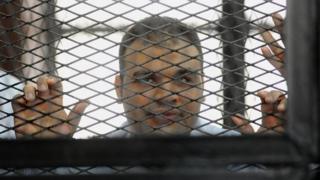 File photo of Mohamed Badr in jail (4 December 2013)