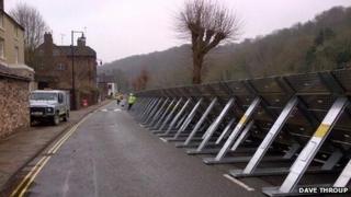 Erecting flood barriers
