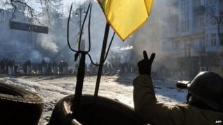 An anti-government protester face police in Kiev. Photo: 4 February 2014