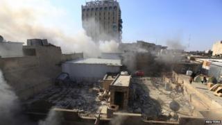 Smoke rises after a car bomb goes off in Khilani Square in central Baghdad, Iraq, on Wednesday