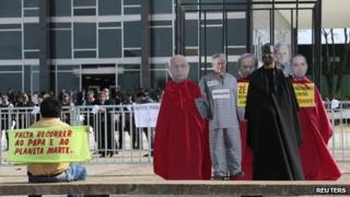 A protesters demonstrate in front of the Federal Supreme Court of Brazil on 18 September, 2013
