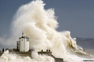 Huge waves crash into a wall
