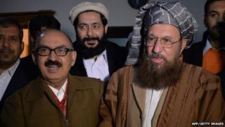 Tehreek-e-Taliban Pakistan (TTP) committee member and senior religious party leader Maulana Sami-ul-Haq (R) shakes hands with Special Assistant to Pakistan"s prime minister Irfan Siddiqui after their meeting at the Khyber Pakhtunkhwa House in Islamabad on February 6, 2014.