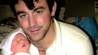 Thomas Ward and his newborn daughter