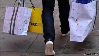 A man carrying bags of shopping