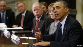 US President Barack Obama meets with health insurance chief executives at the White House in Washington 15 November 2013