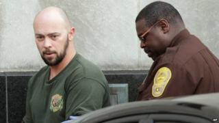 Robert Hoffman (left) is escorted from a court in Norfolk, Virginia. Photo: 6 December 2012