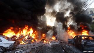 Flames rise after a car bomb blast in Beirut on January 2 2014