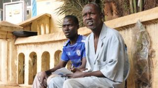 Alassane Maiga and a client