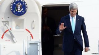 US Secretary of State John Kerry waves upon his arrival at a military airport in Seongnam, south of Seoul, 13 February 2014