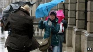 Pedestrians in Dublin's city centre struggled with their umbrellas as storms sweep across the country on Wednesday