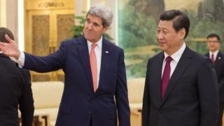 John Kerry (left) will discuss bilateral and regional issues with Xi Jinping