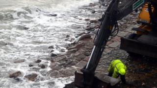 Man repairing slip way