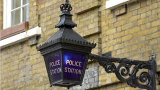 A blue lamp outside the St John's Wood police station, in London