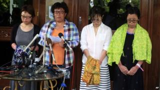 Japanese divers, from right: Nahomi Tomita, Atsumi Yoshidome, Emi Yamamoto, and Aya Morizono talk to journalists at a hospital in Bali, Indonesia, 20 February 2014