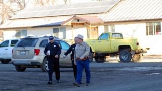 Authorities visit the crime scene on Friday morning 21 February 2014