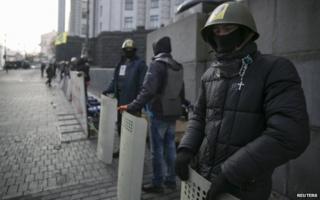Activists guard a government building Kiev