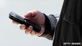 Hand holding mobile phone
