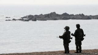 File photo: South Korean marines search for possible survivors and bodies from a sunken Patrol Combat Corvette PCC-772 Cheonan at Baengnyeong island near the border with North Korea, 30 March 2010