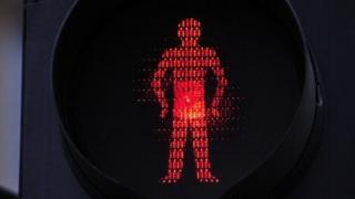 A close-up of red-man don't walk sign.