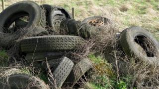 Tyres in a field