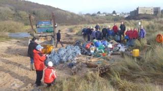 Volunteers with their haul of beach litter