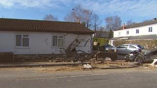 Damaged car and property