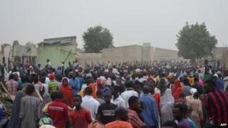 People gathered on the spot after two explosions rocked in Maiduguri, north-eastern Nigeria, a region plagued by Islamist insurgency of Boko Haram.
