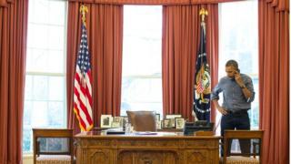 President Obama talks on the phone