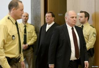 Bayern Munich President Uli Hoeness (2nd R) arrives with his lawyer Hanns W Feigen (3rd L)