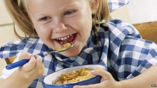 girl eating breakfast cereal