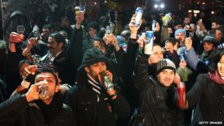 People drink beer in a square in Ankara, Turkey
