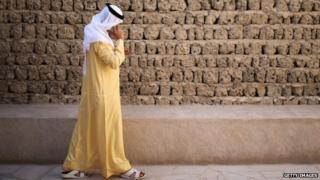 An Emirati man talks on the phone