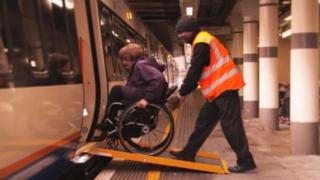 Tanni Grey-Thompson boarding an Overground train