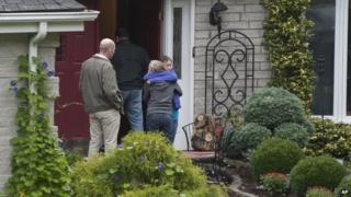 Visitors arrive at the home of Jeffrey Giuliano in New Fairfield, Connecticut, 28 September 2012