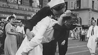 US Navy sailor Glenn Edward McDuffie (L) kisses a nurse in Times Square in an impromptu moment at the close of World War Two, after the surrender of Japan was announced in New York (14 August 1945)