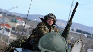 A Russian armoured vehicle drives on the road between Simferopol and Sevastopol (17 March 2014)