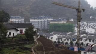 Cranes over building in China