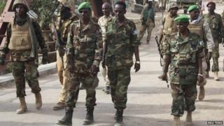 Amisom Djiboutian Commander Col Osman Doubad (C) walks with the Hiran Governor Abdi Farah Laqanyo and Amisom chief of staff Gen Soubaghle, after successfully capturing the al Shabab-held Bulo-burde in the Hiran region of Somalia - 14 March 2014