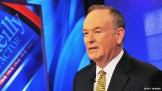Bill O'Reilly poses on the set of his television show, the O'Reilly Factor.