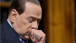 A file photo taken on 25 May 25 2012 shows former Italian Prime Minister Silvio Berlusconi reacting during a press conference at the senate in Rome.